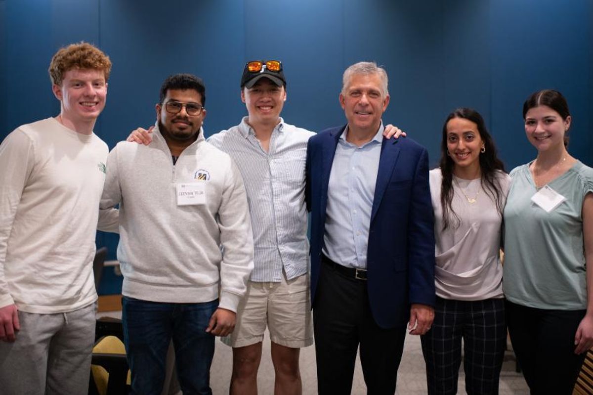 UMassD alum Peter de Silva '84 with business students