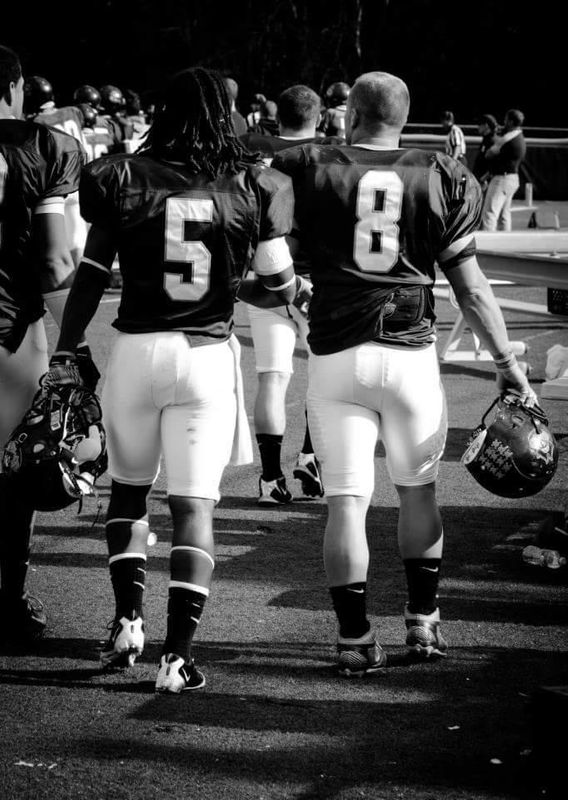 UMassD football players on field