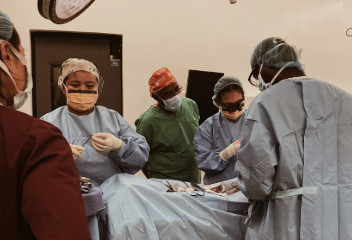 Nursing alumna performs surgery with others