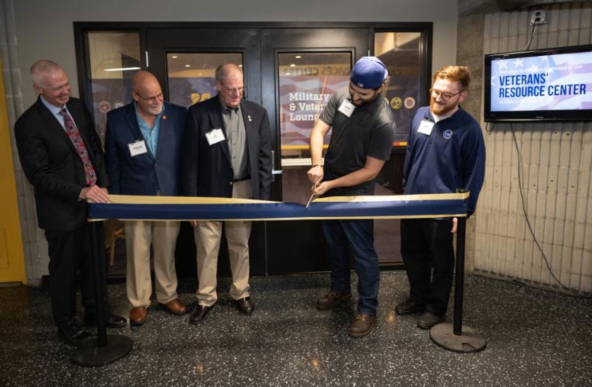Chancellor and guests cutting ribbon