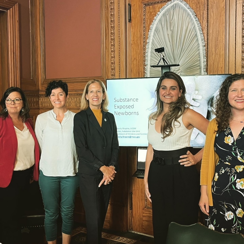 State Rep Carole Fiola poses with alumna Thais Sousa