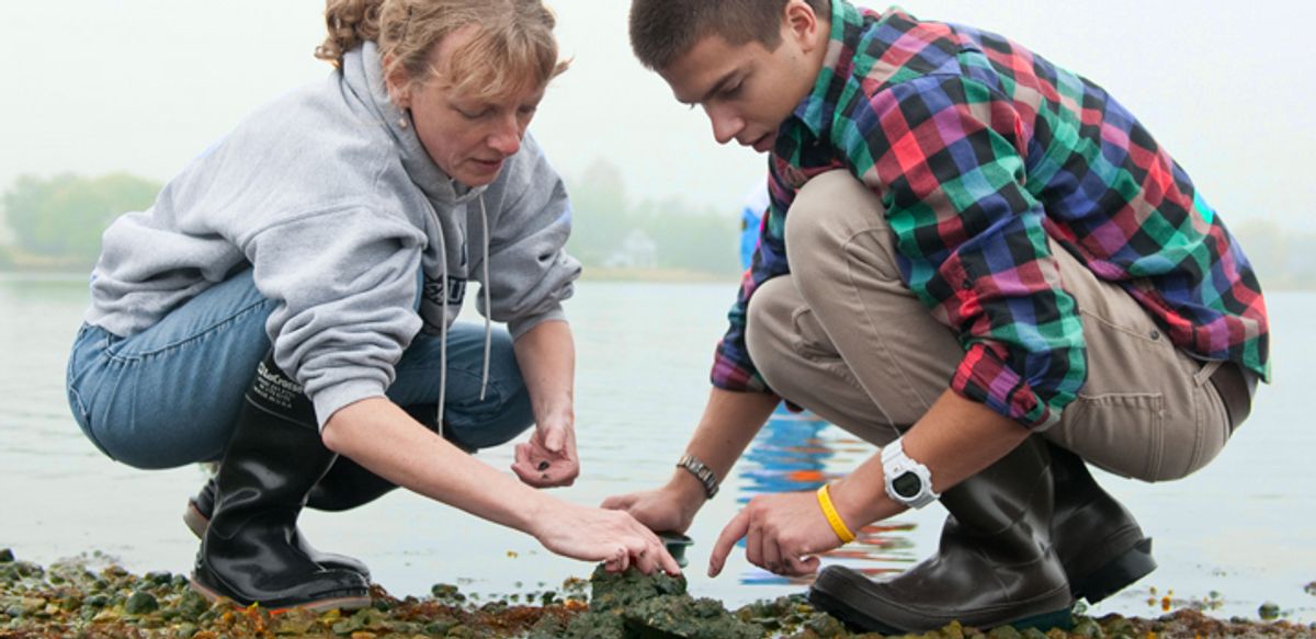 Teacher and student in biology living classroom