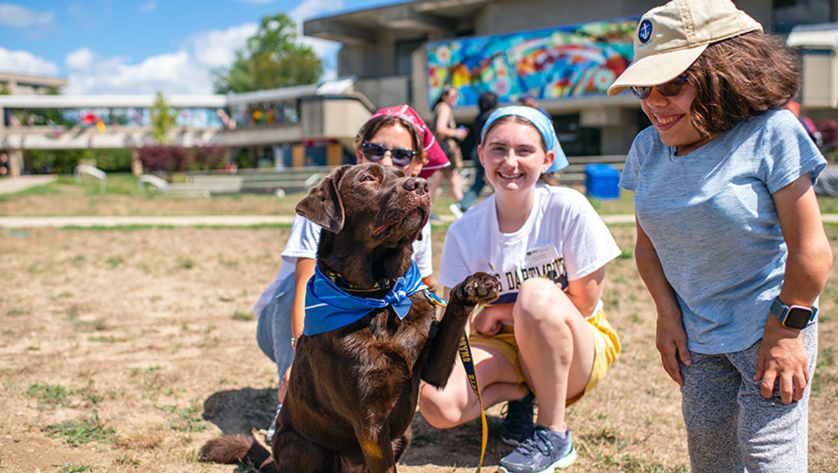 Homer McConnell gives student a fist bump