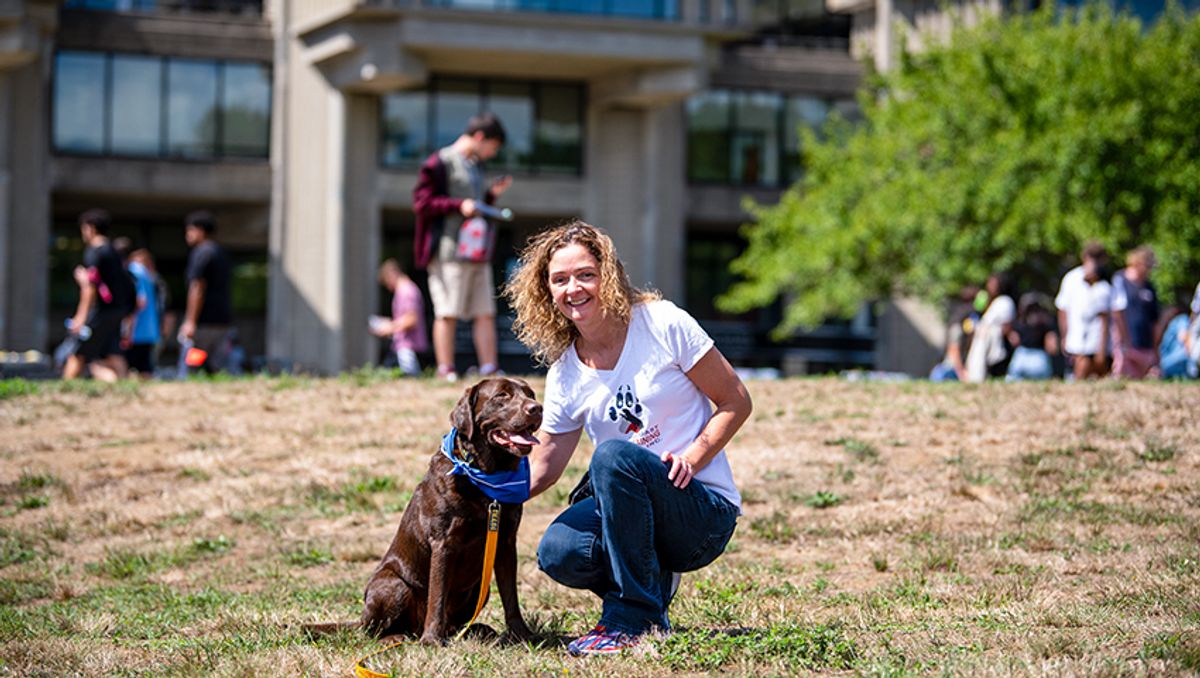 Sandy McConnell '97 and her dog, Homer, at Convocation