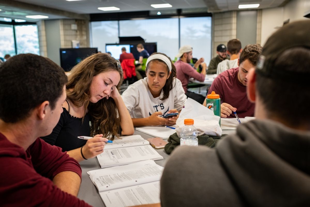 Female students leading a study group in renovated engineering laboratory