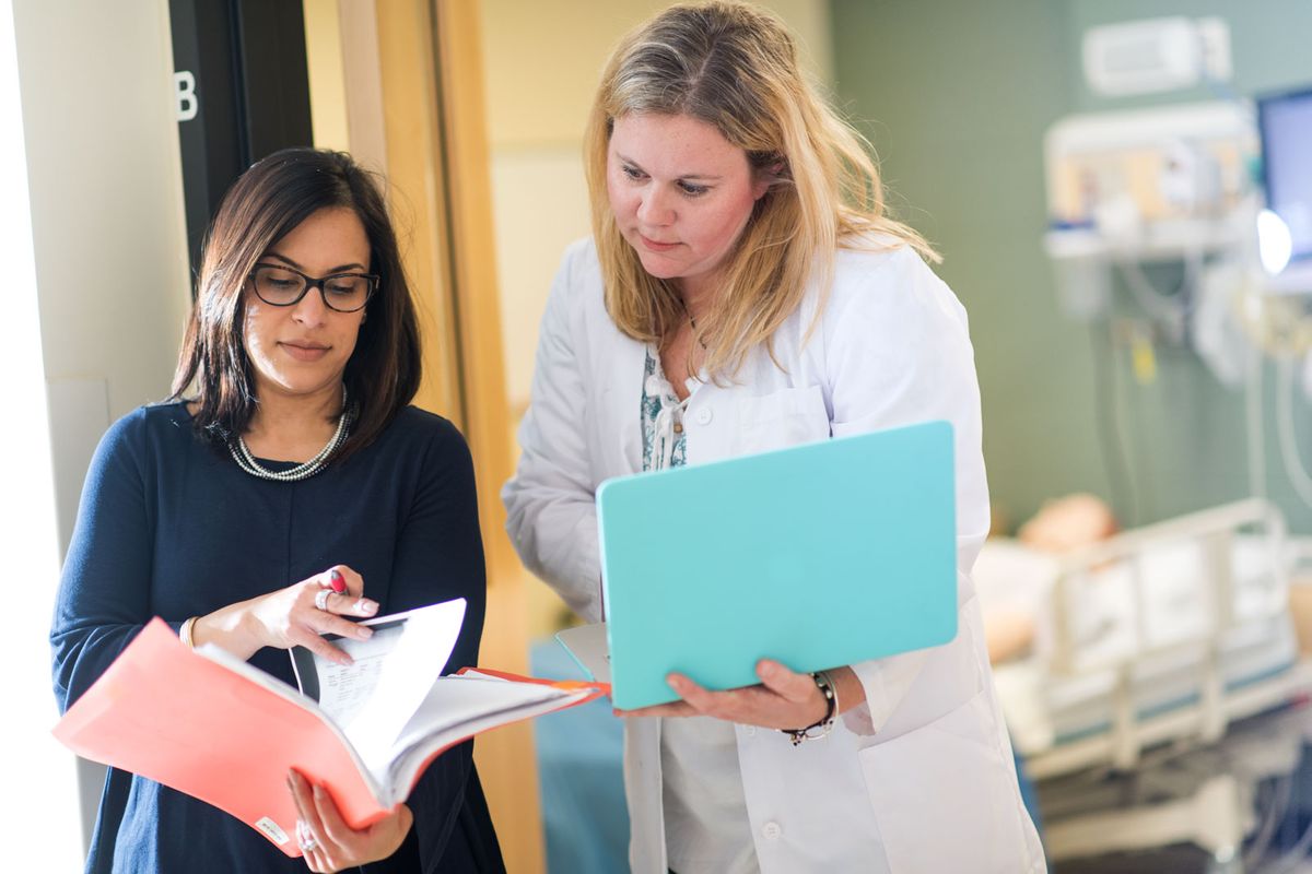 Nursing PhD students conversing.