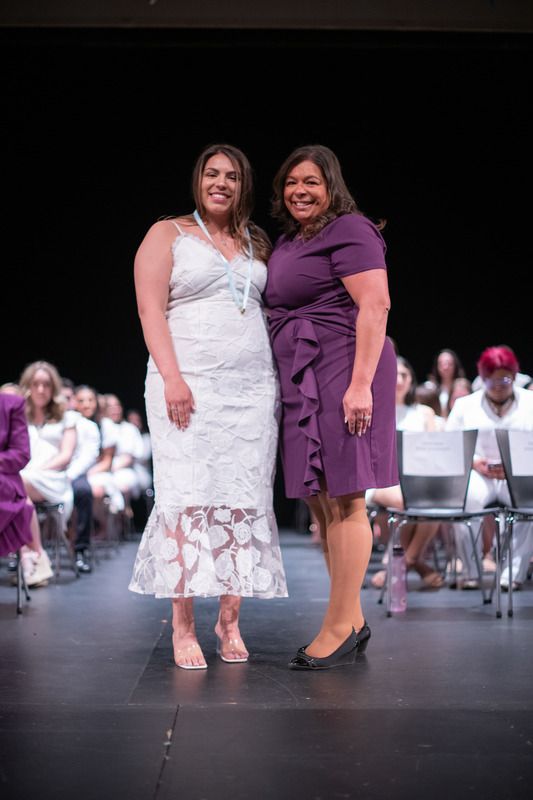 Student and parent on stage