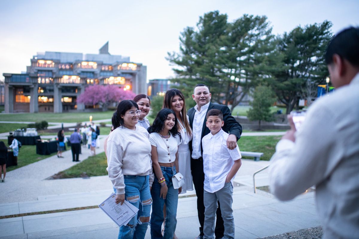 Family posing for photos outside