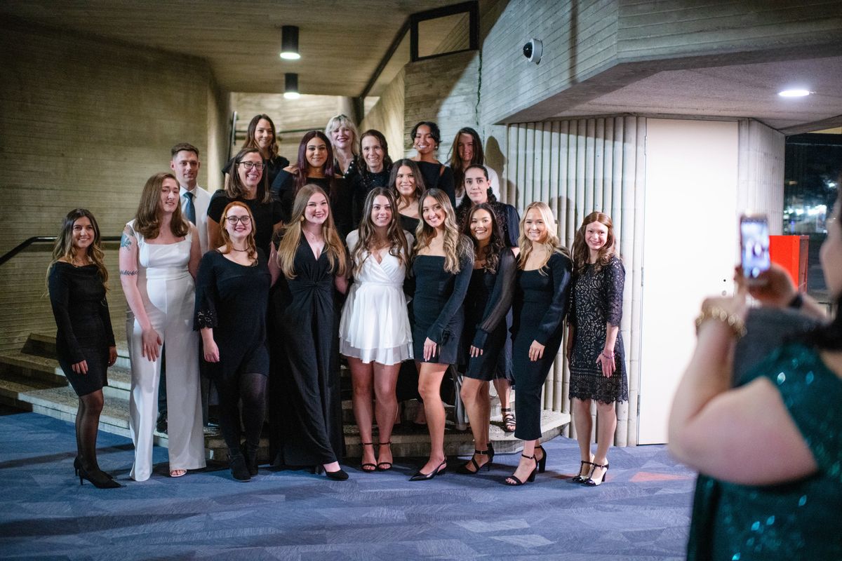 ABSN graduates gathering for a photo pre-ceremony