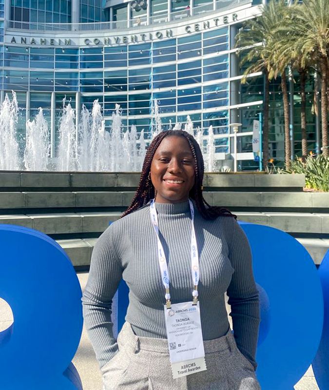 Taonga standing in front of Anaheim Convention Center