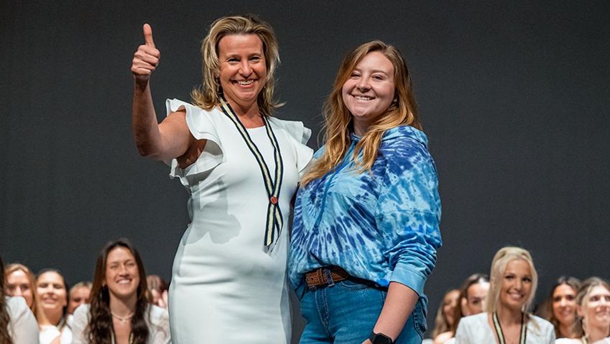 Joyce Zielinski with her daughter after being pinned