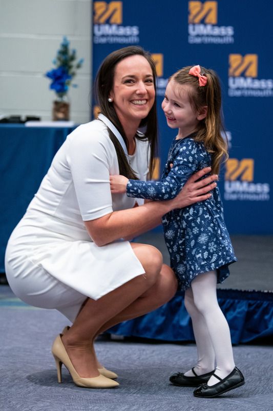 Little girl hugging her mother