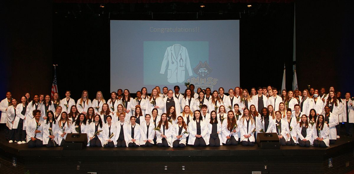 Large group shot of Class of 2024 nursing students on stage