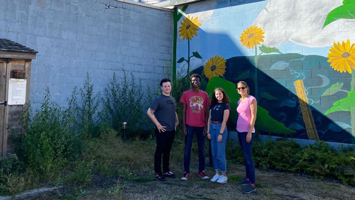 Professor McGoldrick with senior students Jay Weygand, Axel Jeremie, and Alexis Canaday on the lighting installation day