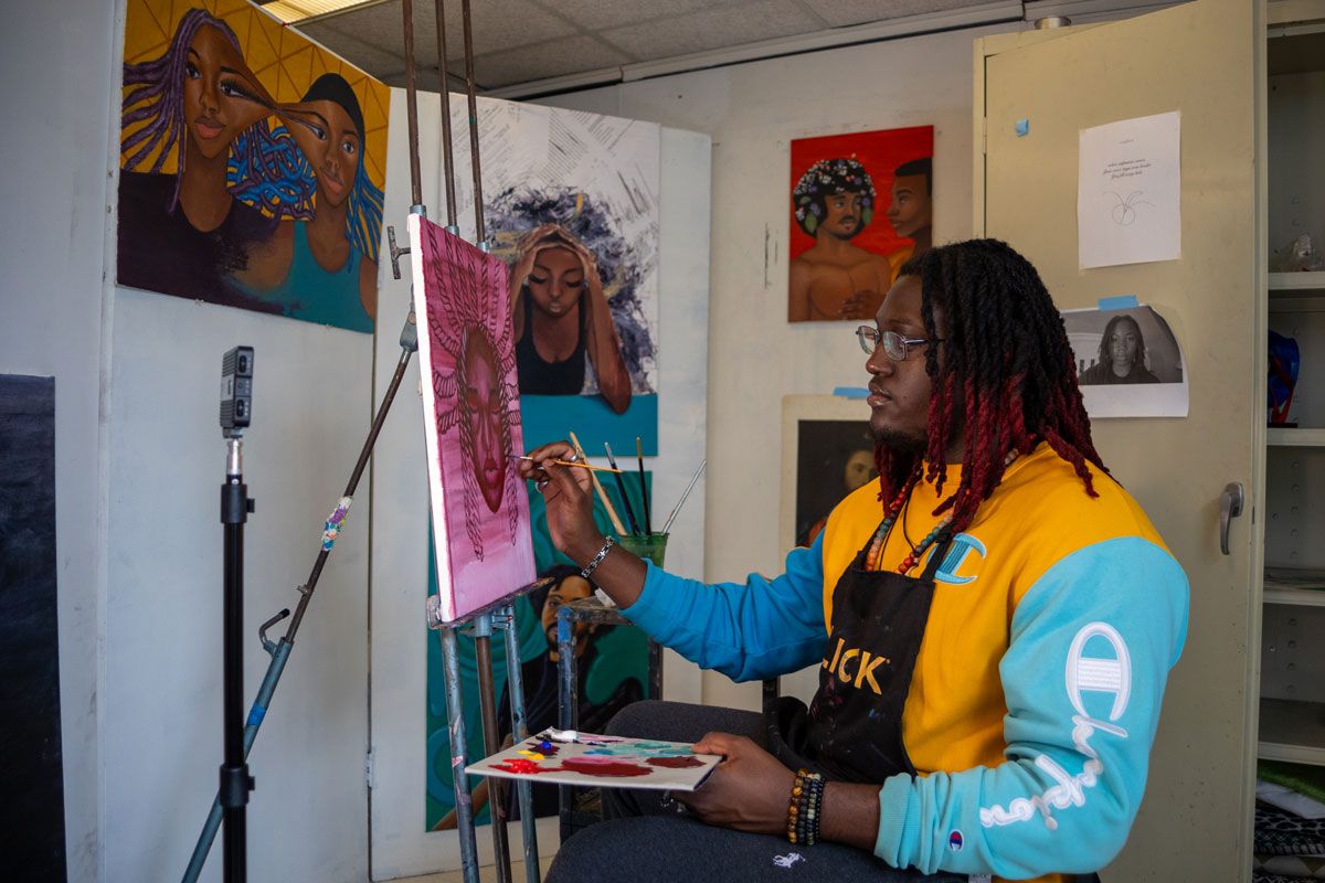 Omauri Byron-Edwards painting in studio