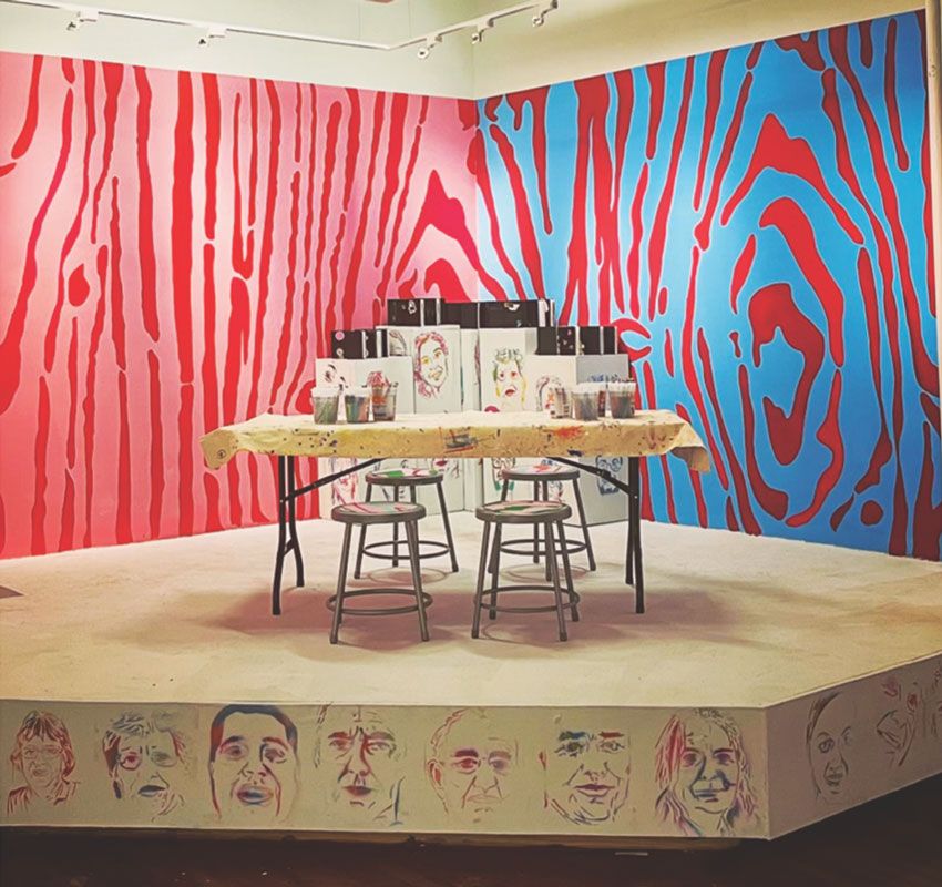 David R. Modler: Draw and Play Here, 2022. Acrylic painted directly to wall (10 x 20 feet), spray enamel painted stencil portraits, and collaborative visual journals.