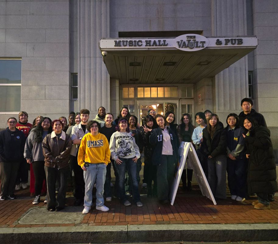 Student group photo outside The Vault entrance.