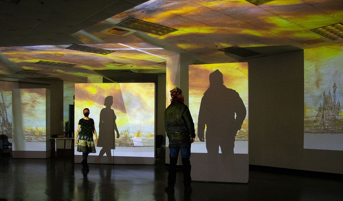 Viera Levitt and video artist Don Burton test a projection in the Swain Studio