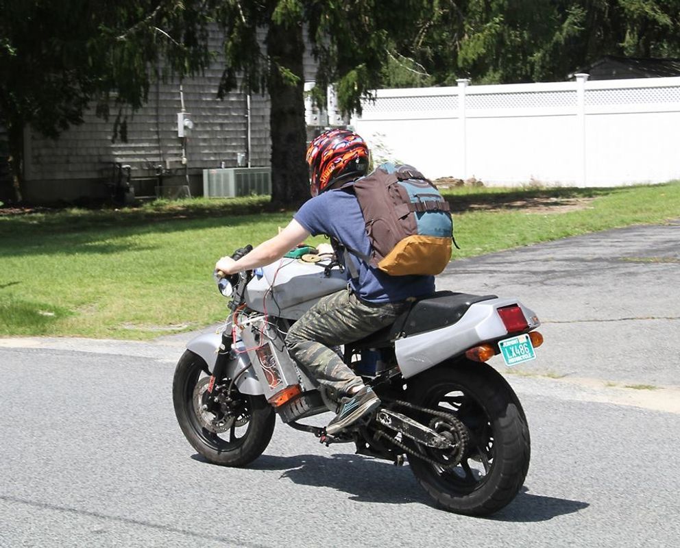 Dustin riding the electric motorcycle