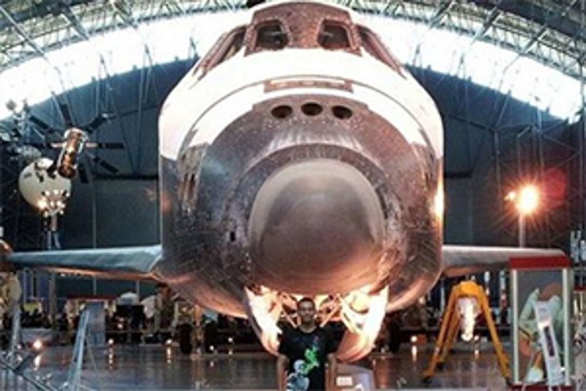 Dylan Baker in front of shuttle