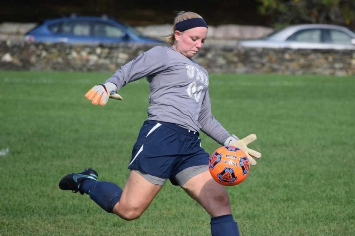 Madison Boucher kicking the soccer ball