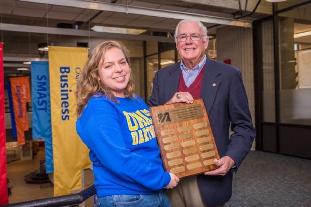 Sofia Reppucci posing with a plaque