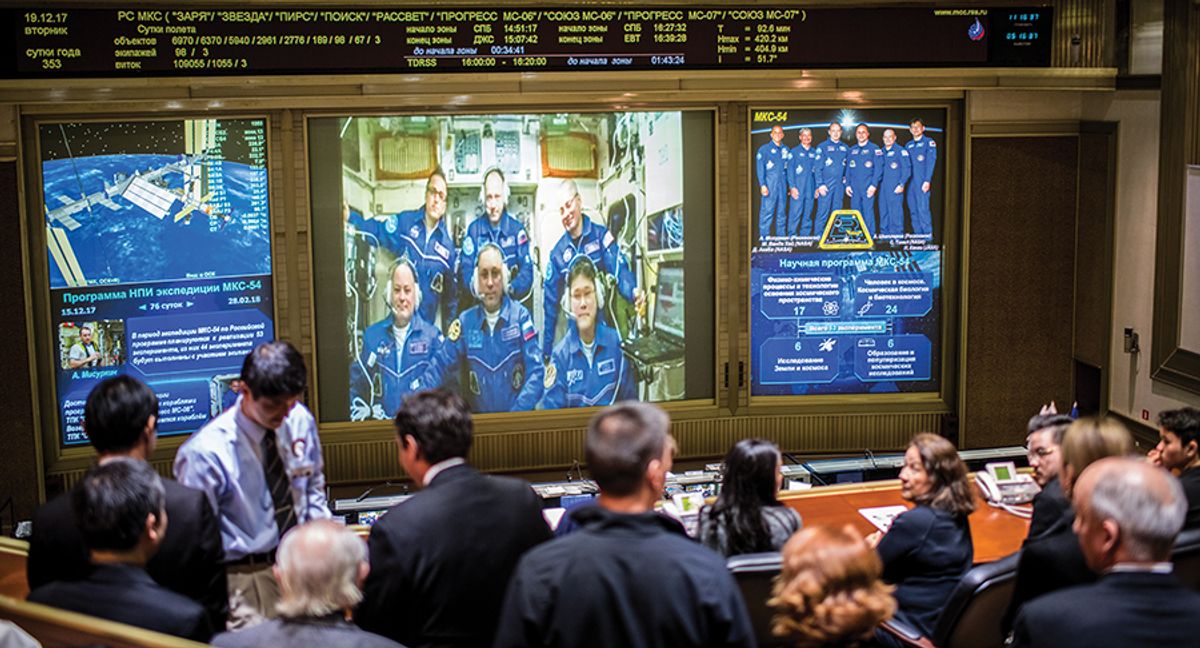ISS crew members speaking with family and friends via TV at the Moscow Mission Control Center after they docked from the International Space Station, 12-19-17. 2017.