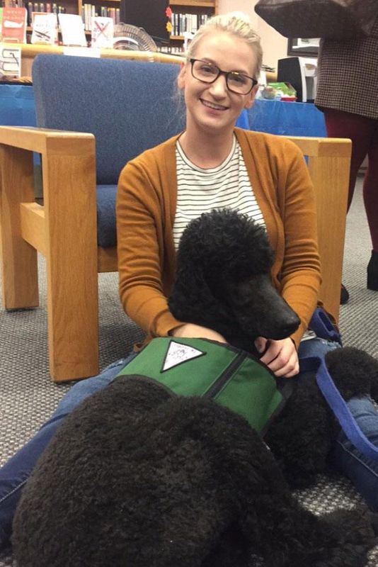 Kayla Venckauskas with one of the therapy poodles