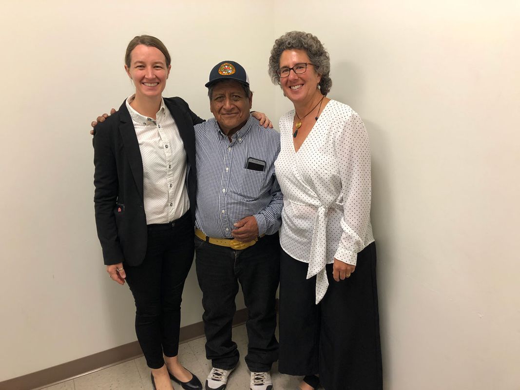 Professor Hillary Farber standing with Florence Project attorney and client 