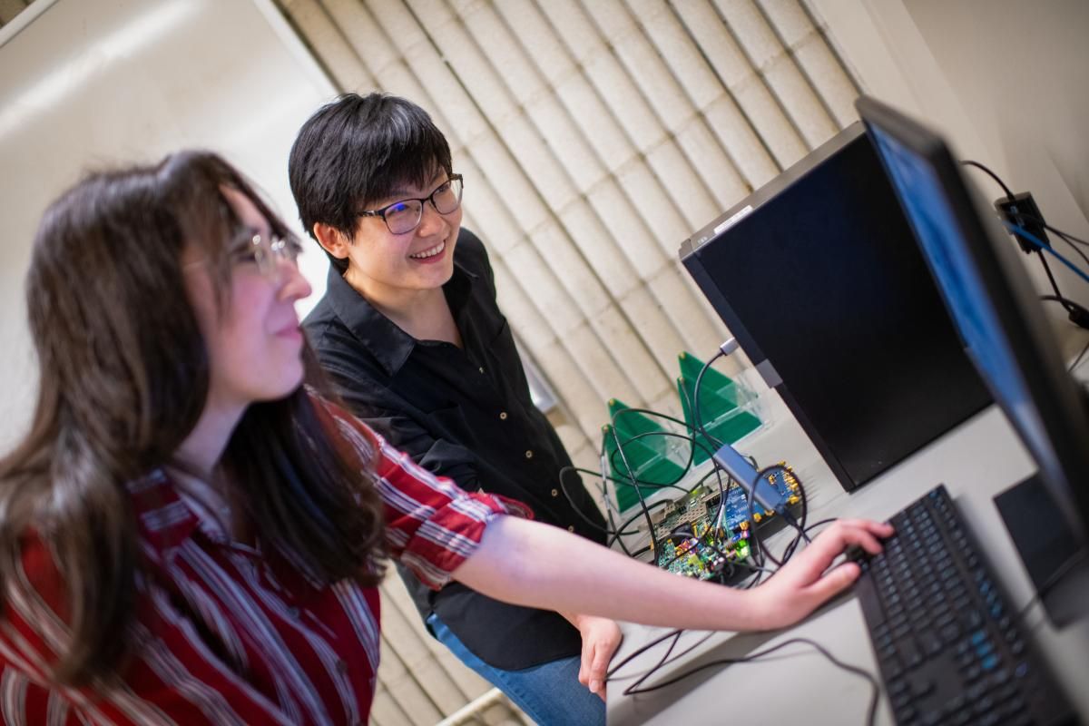 Dr. Ruolin Zhou with Electrical Engineering student Erika Caushi