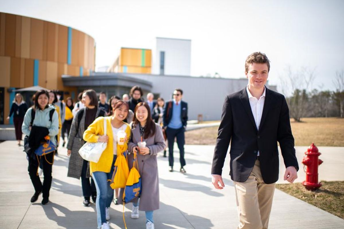 Senior political science major and Student Trustee Maxwell White leads a tour of campus