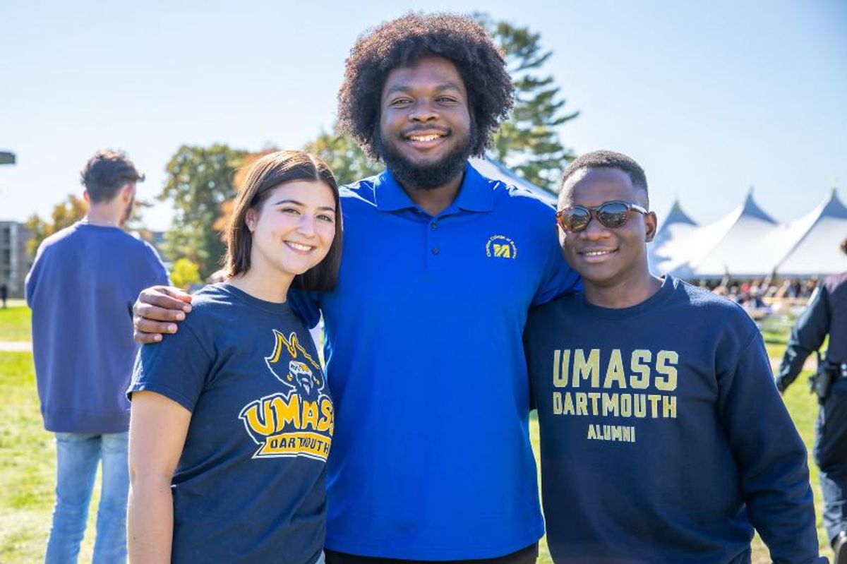 Capri McLucas poses with classmates Gamaliel Daffeed Janvier '23 and Narcisse Kunda '22 at Blue & Gold Weekend