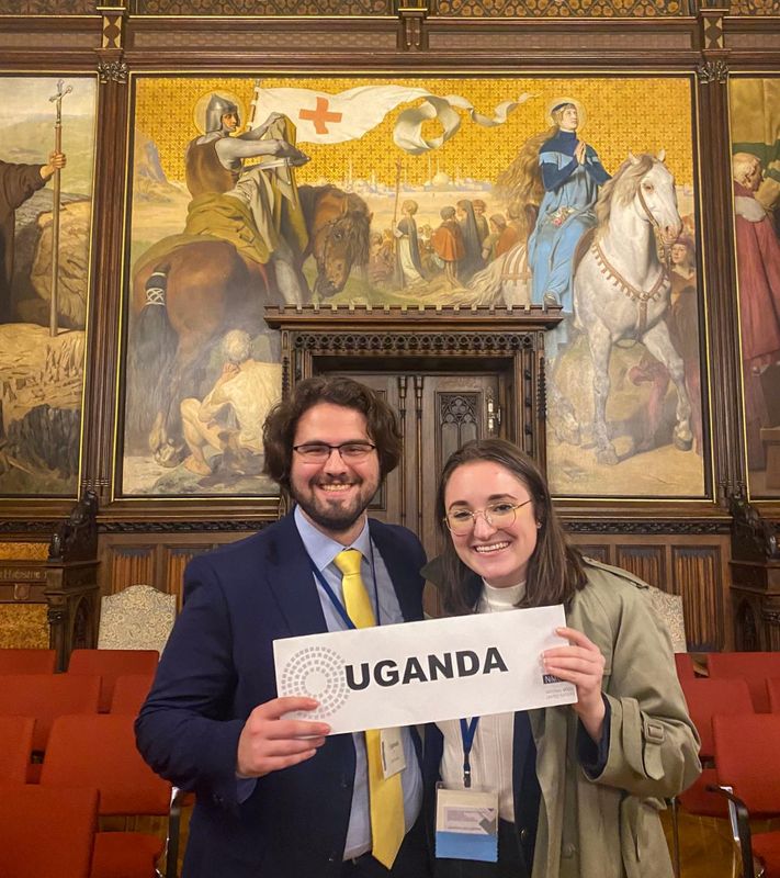 Nicole Kach (right) and Gent Haviari (left) pose after winning an Outstanding Position Paper Award at the NMUN Germany Conference.