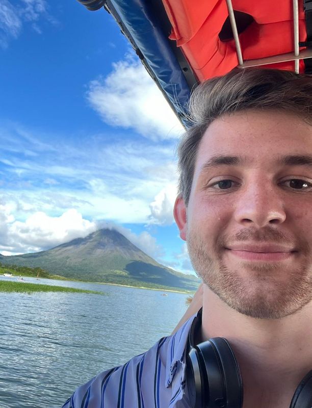 Cameron Hixon pictured in front of the Arenal Volcano in La Fortuna, Costa Rica