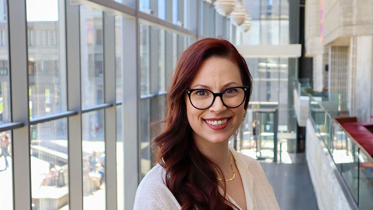 Kathryn Grande '23 pictured in the Claire T. Carney Library