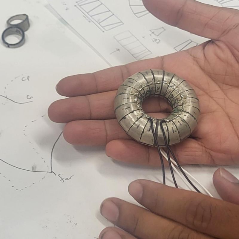 Sahoo holding the toroidal transducer prototype