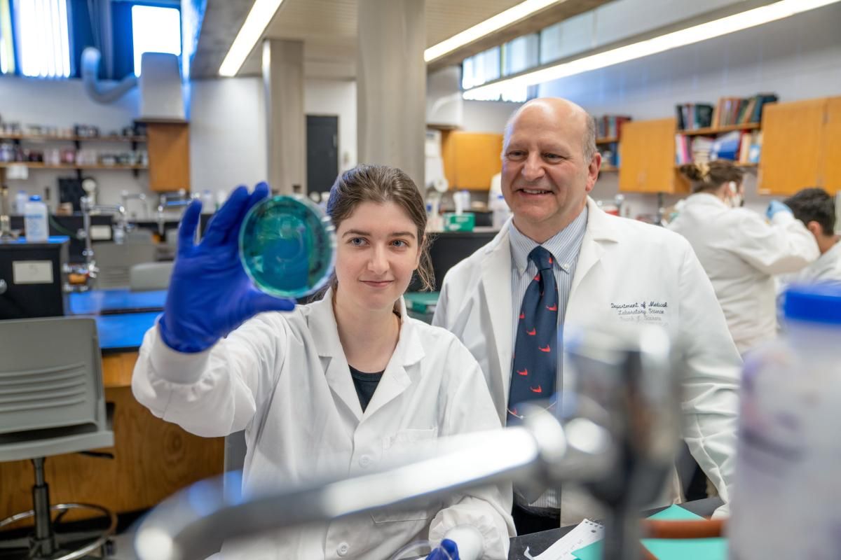 Professor and student in lab