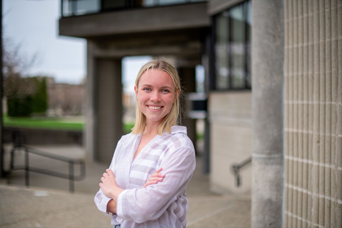 Student Maggie McCafferty standing outside the UMassD library