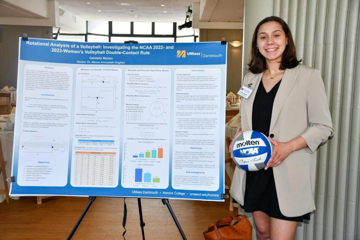 Gabby Monico standing with her research poster and holding a volleyball at the Honors College Convocation