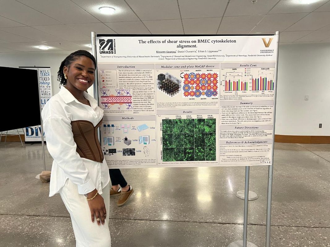 Kissamy Georges with her research poster that won 