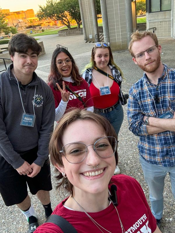 Members of The Torch take a selfie outside the library.
