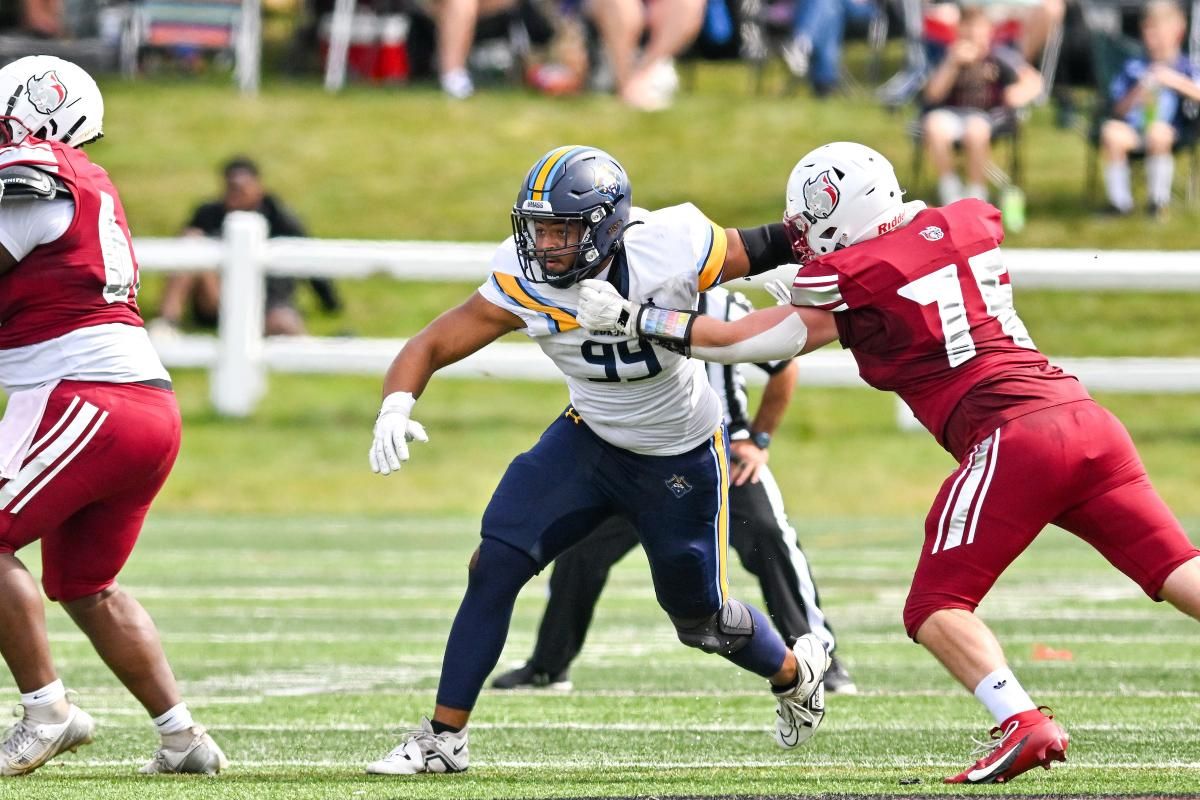 Ancil Alexander penetrates the backfield at Anna Maria College