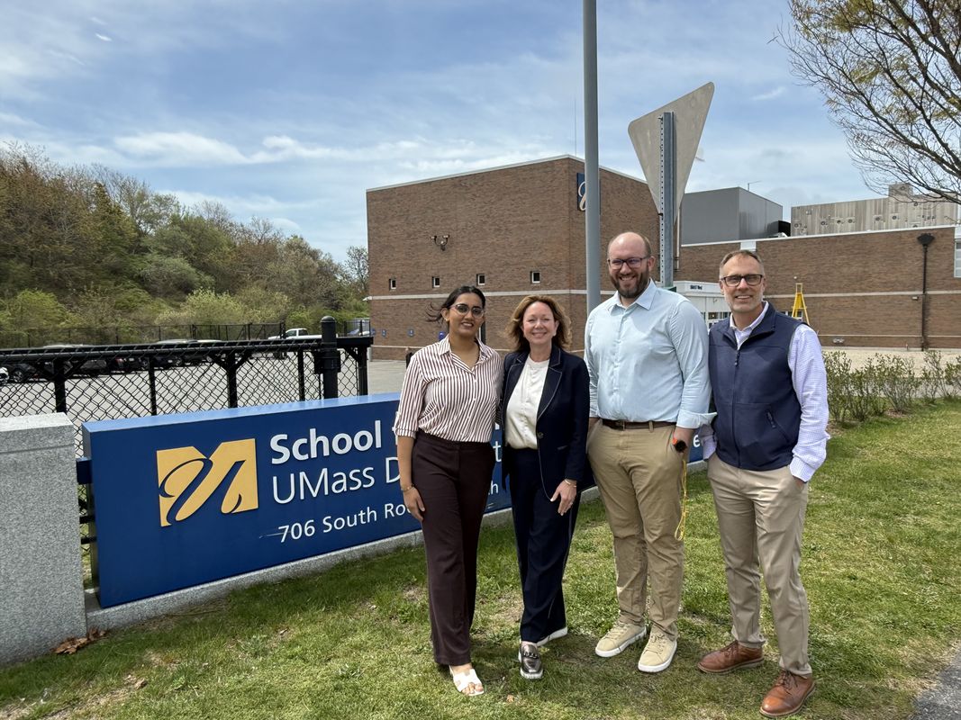 Kavya Shah '29, Cheryl Smyre (IAM/Parkdale), Chris Ward (SMAST), Chad Bolick (IAM/Parkdale) standing outside of the SMAST West campus