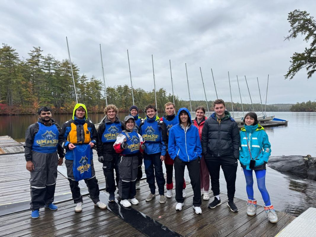 The 2024 UMassD sailing team standing on a dock