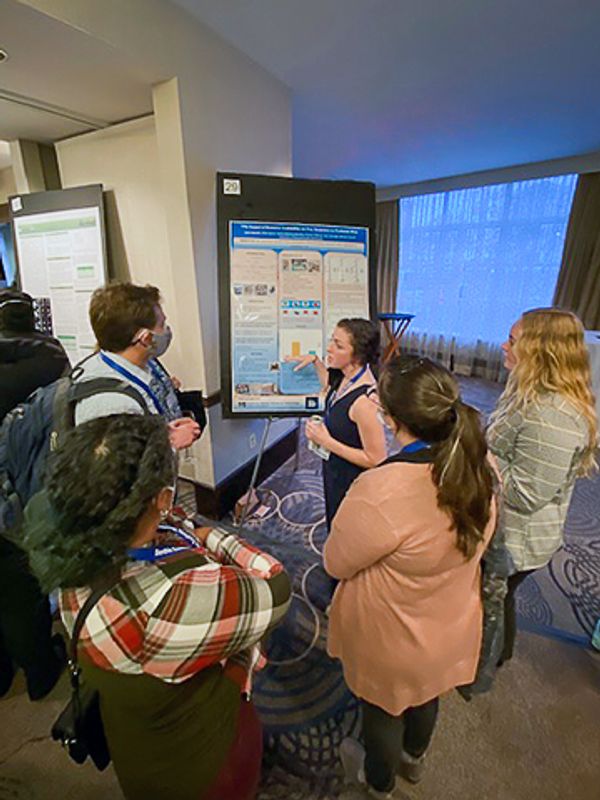 Presenting poster at biology conference