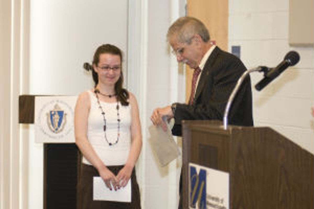 A student receives an award.