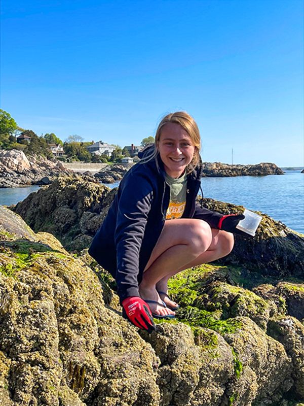 Sitting on a rock collecting specimens