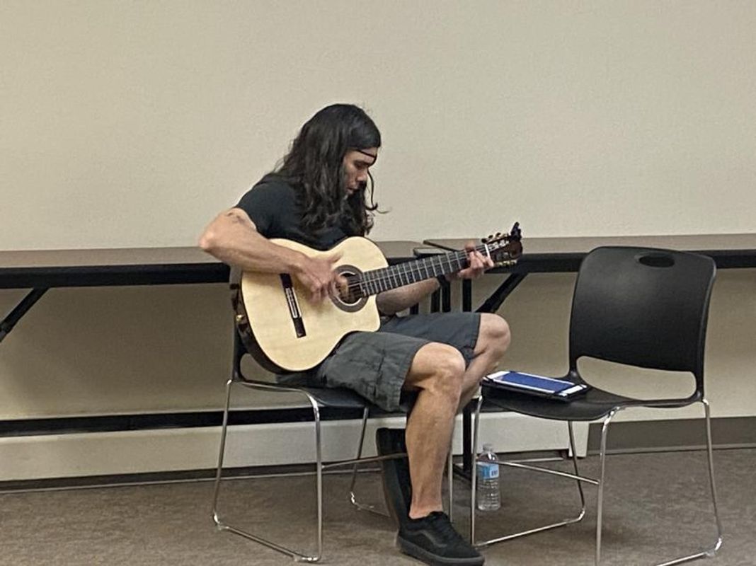 Musician practicing his guitar