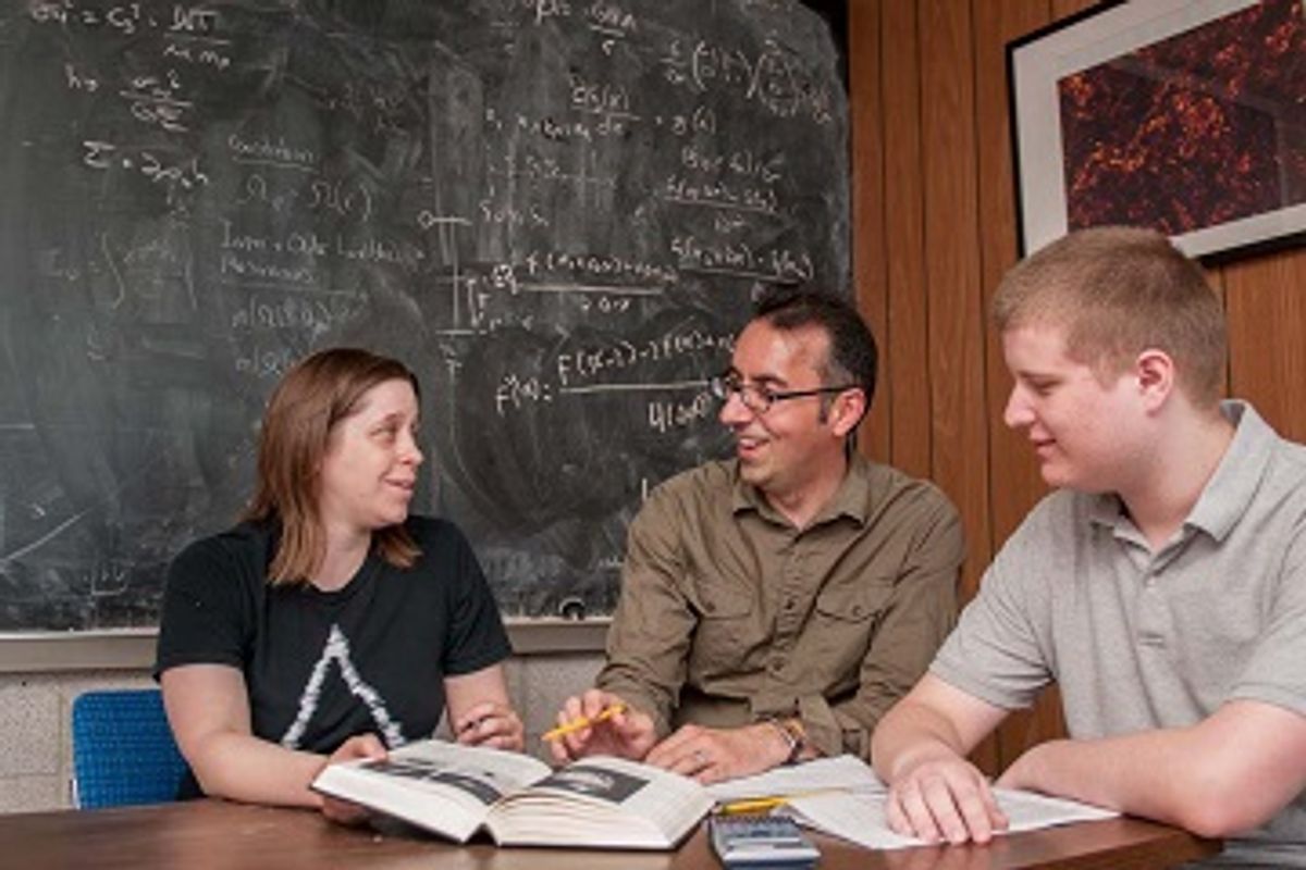 2 students and a professor talking