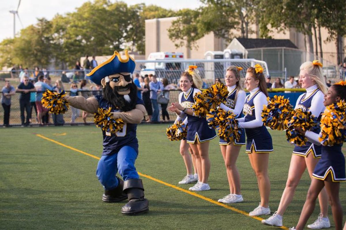Arnie & cheerleaders at homecoming
